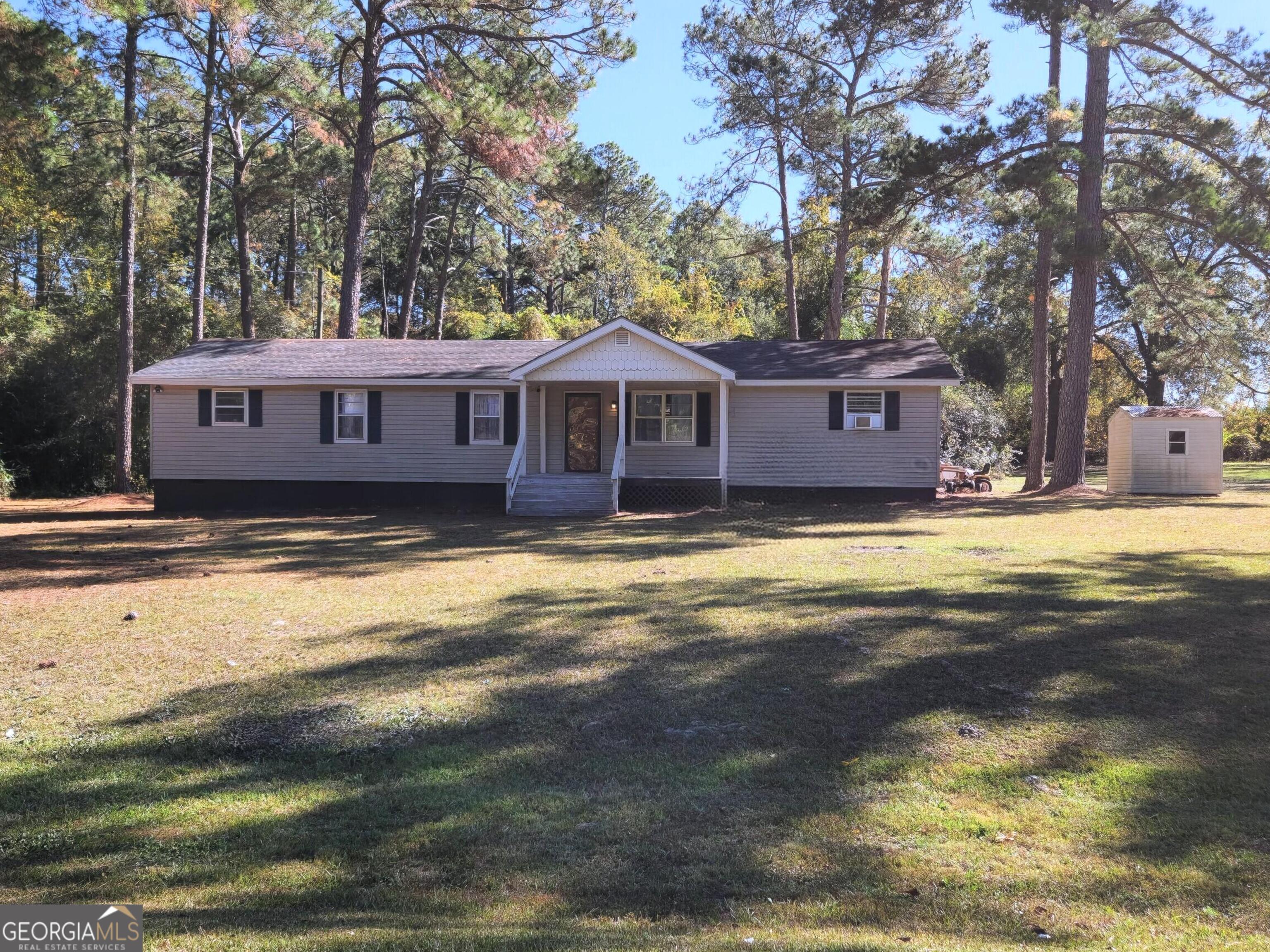 985 Frank Road Ocilla, GA 31774 - Photo 2 of 13 a view of a house with a swimming pool