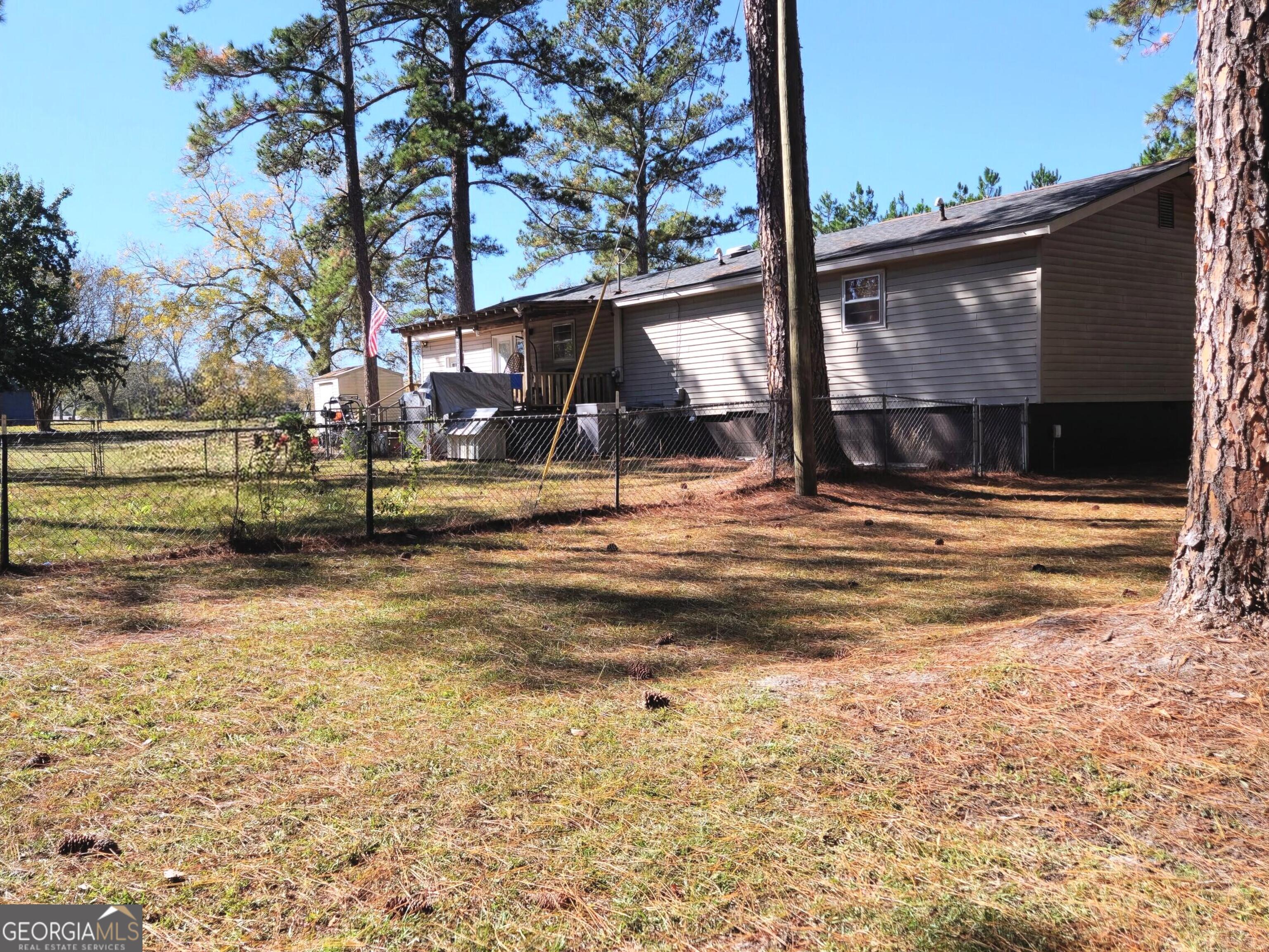 985 Frank Road Ocilla, GA 31774 - Photo 3 of 13 a view of a house with a yard