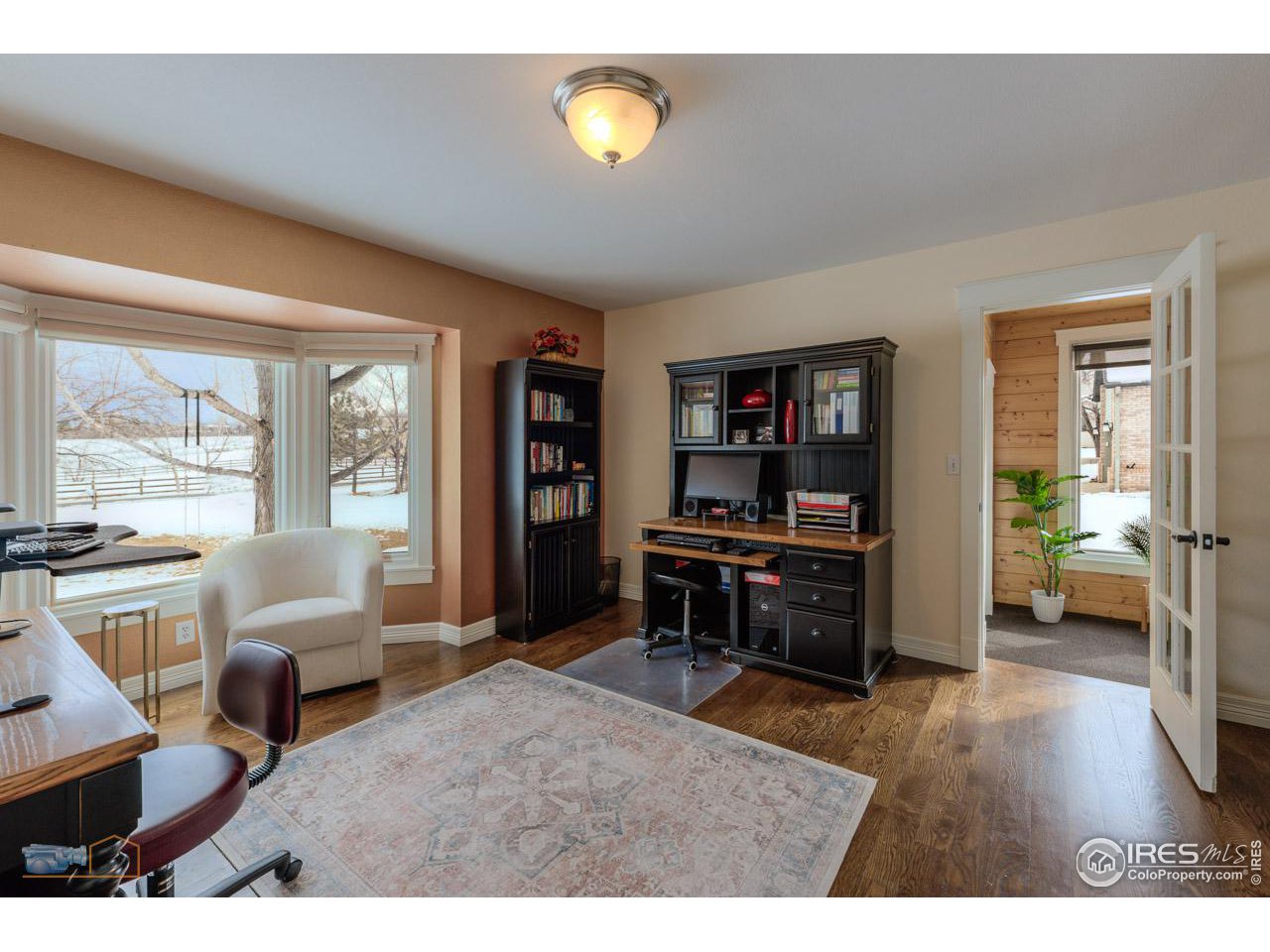 4881 Valkyrie Drive Boulder, CO 80301 - Photo 18 of 39 a living room with furniture and a wooden floor