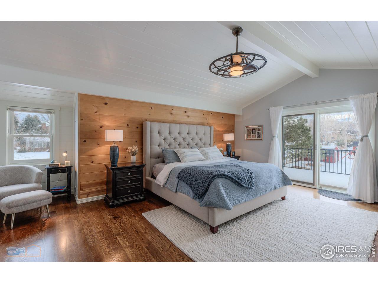 4881 Valkyrie Drive Boulder, CO 80301 - Photo 21 of 39 a bedroom with a bed and a chandelier