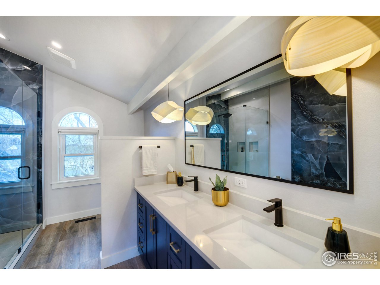 4881 Valkyrie Drive Boulder, CO 80301 - Photo 22 of 39 a bathroom with a sink and a mirror