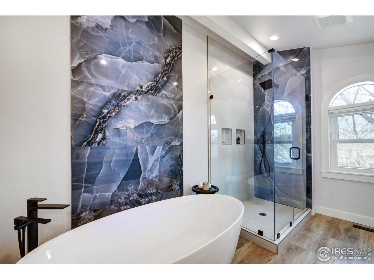 4881 Valkyrie Drive Boulder, CO 80301 - Photo 23 of 39 a bathroom with a bathtub shower sink vanity and a mirror