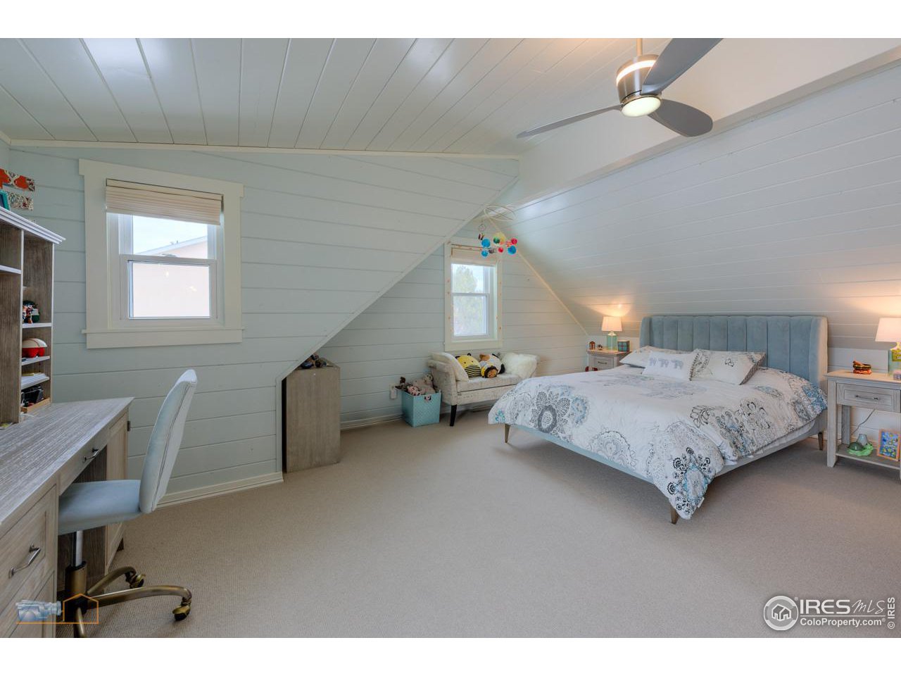 4881 Valkyrie Drive Boulder, CO 80301 - Photo 26 of 39 a bedroom with a bed a desk and chair