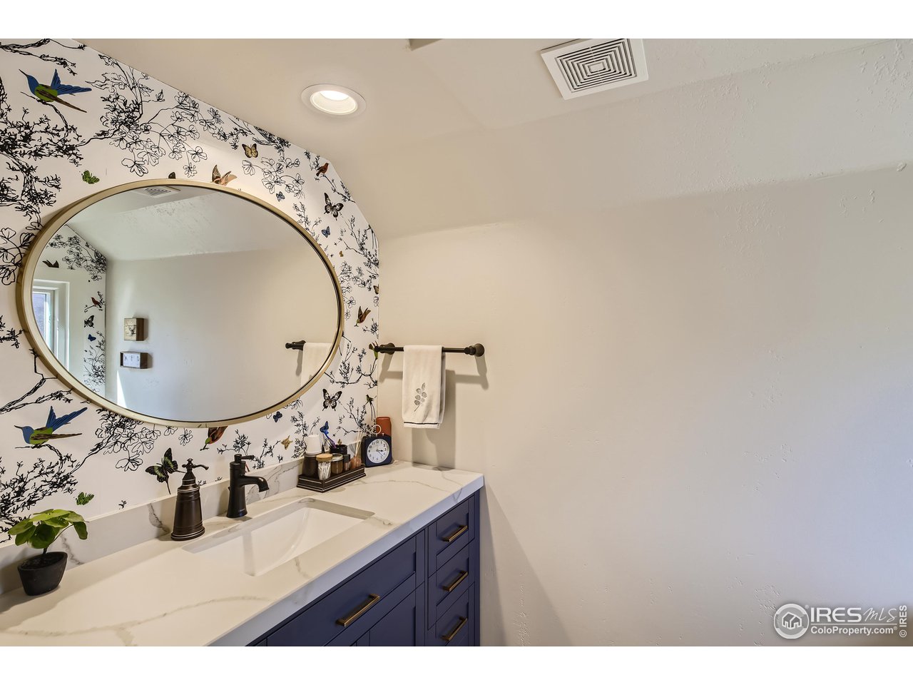 4881 Valkyrie Drive Boulder, CO 80301 - Photo 27 of 39 a bathroom with a sink mirror and vanity
