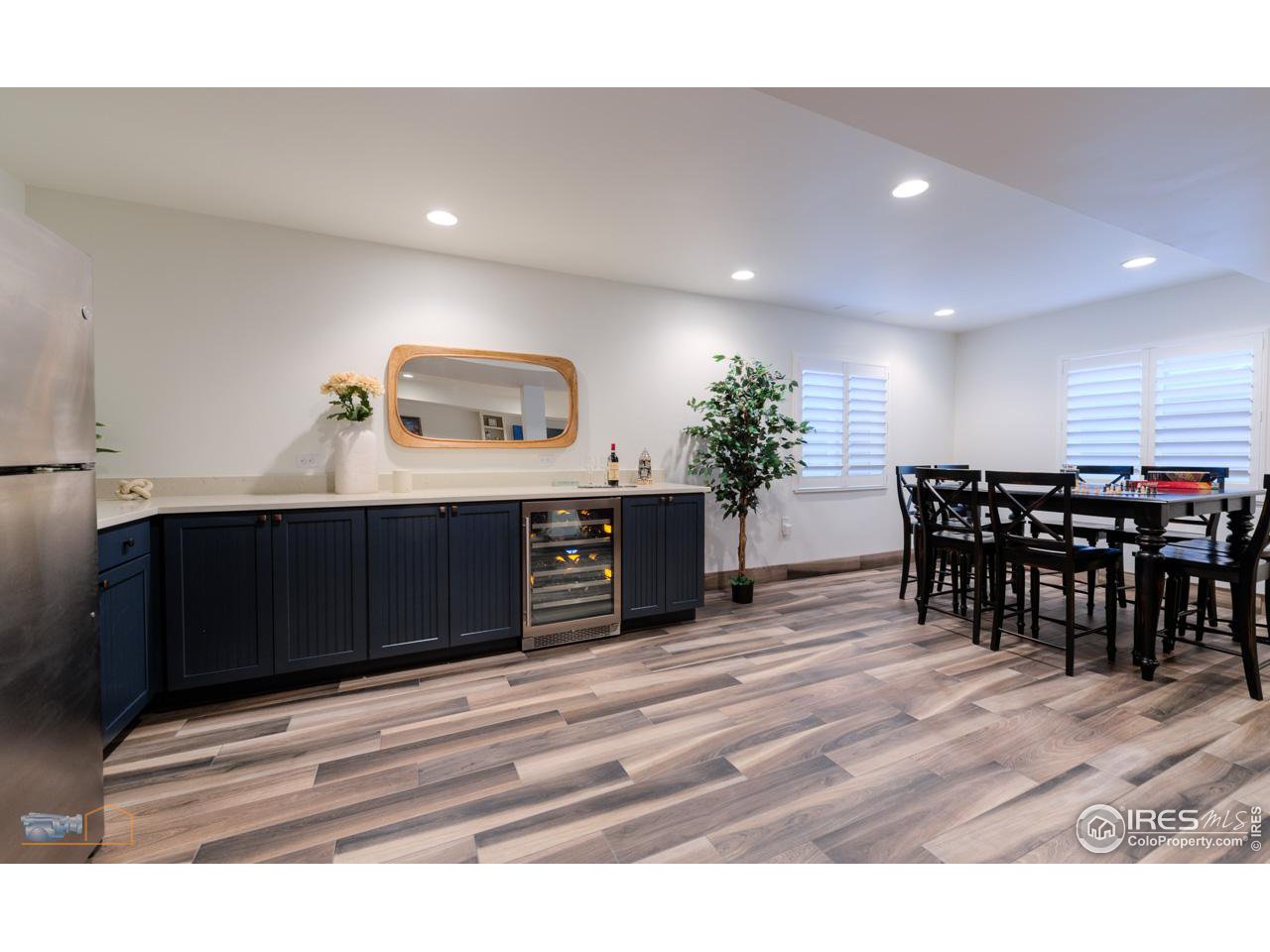 4881 Valkyrie Drive Boulder, CO 80301 - Photo 30 of 39 a living room with stainless steel appliances kitchen island a sink table and chairs