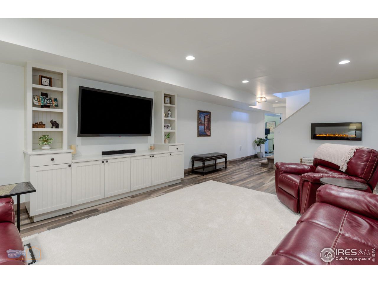 4881 Valkyrie Drive Boulder, CO 80301 - Photo 32 of 39 a living room with furniture and a flat screen tv