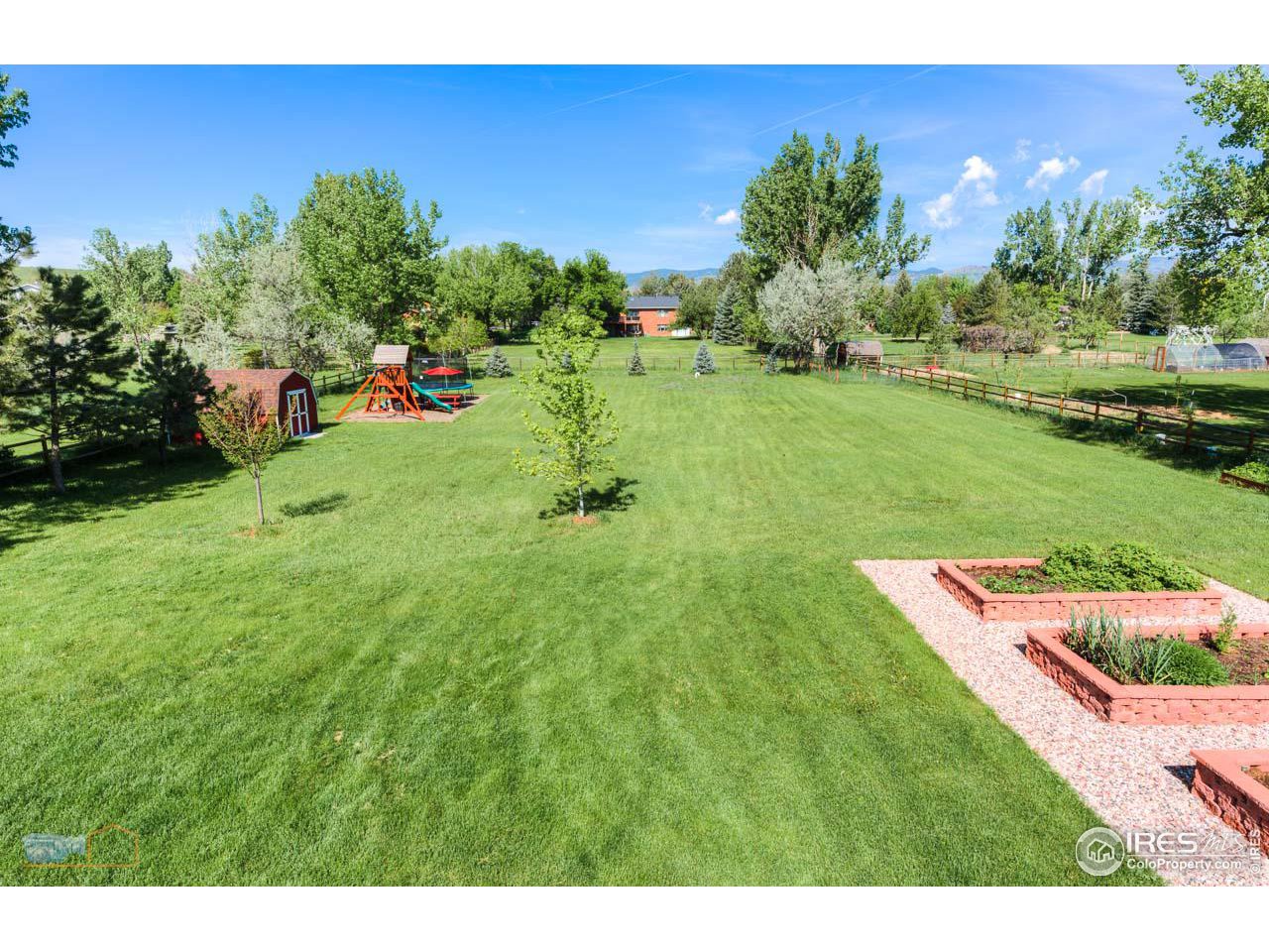 4881 Valkyrie Drive Boulder, CO 80301 - Photo 10 of 39 a view of a backyard with plants and a garden