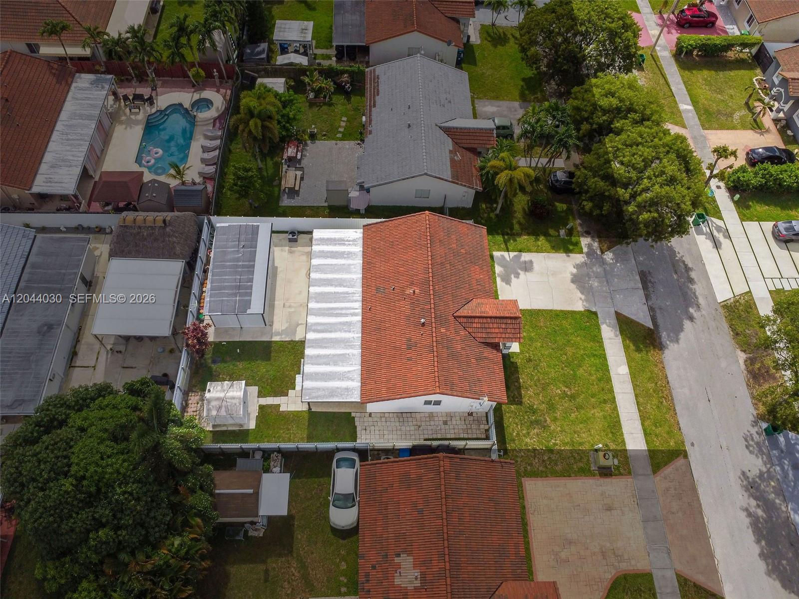 12551 Southwest 223rd Street Miami, FL 33170 - Photo 31 of 35 an aerial view of a house with a yard