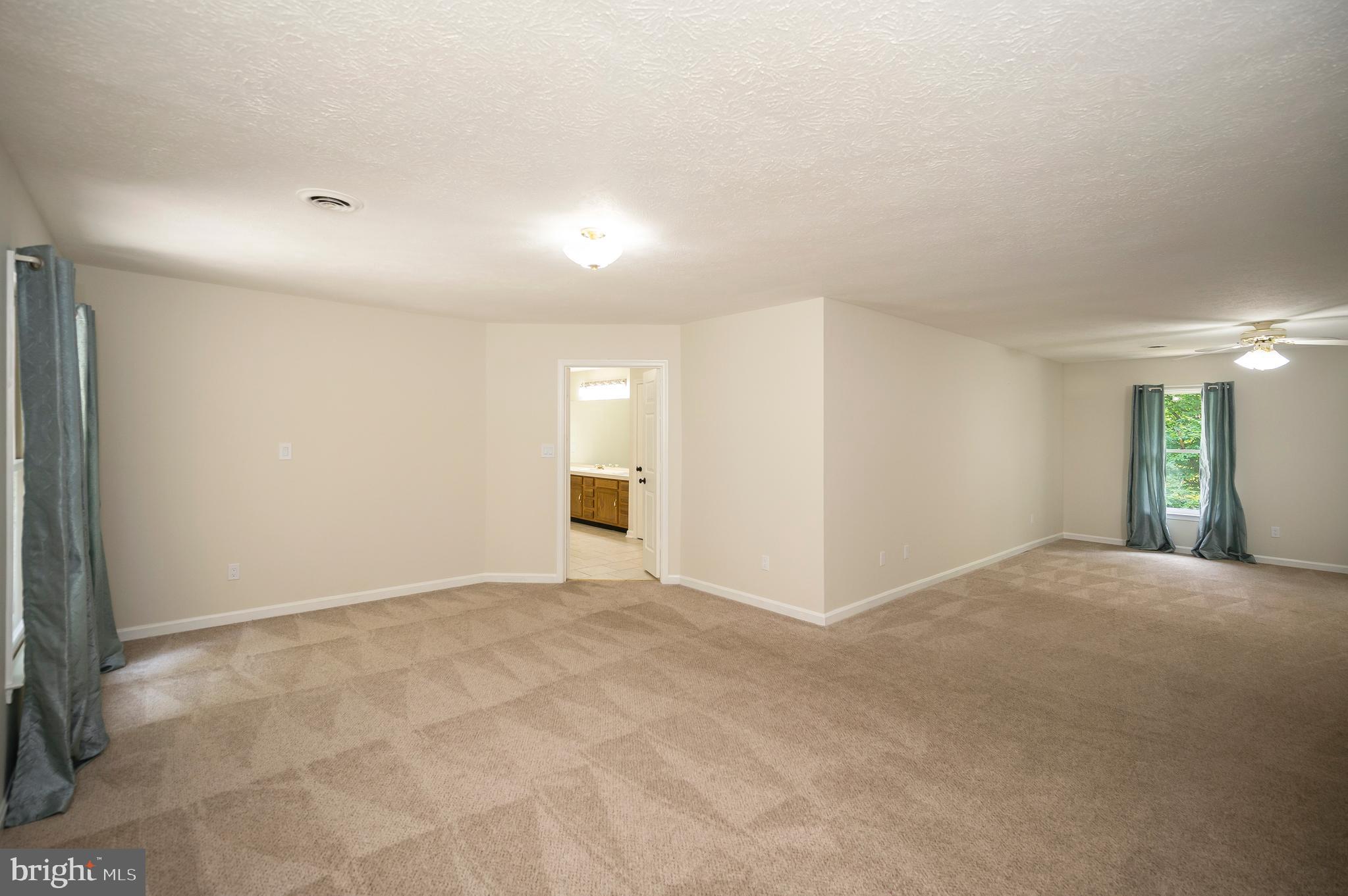104 Dent Road Stafford, VA 22554 - Photo 109 of 118 a view of an empty room with closet and a window