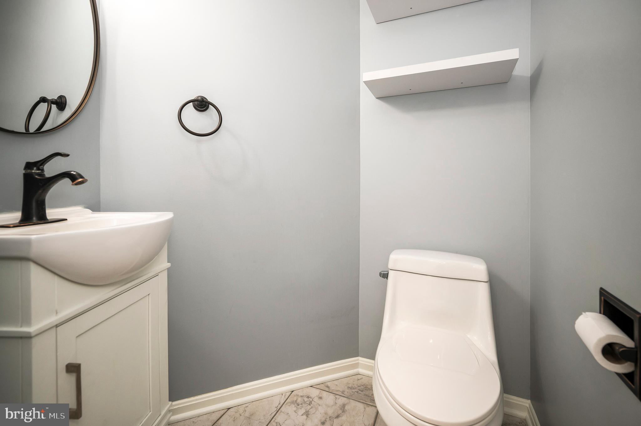 104 Dent Road Stafford, VA 22554 - Photo 28 of 118 a bathroom with a toilet and a mirror