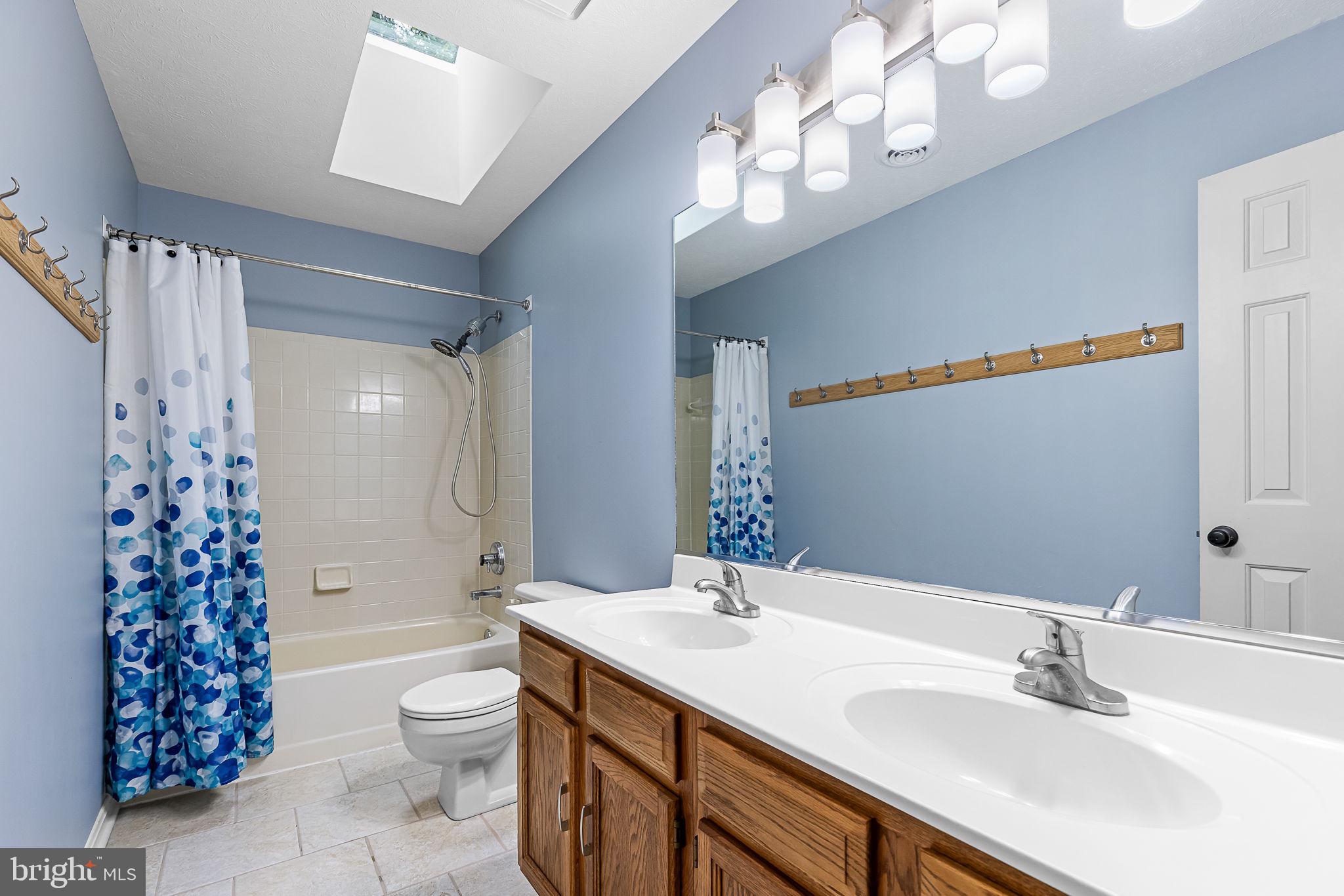 104 Dent Road Stafford, VA 22554 - Photo 45 of 118 a bathroom with a sink a toilet and a mirror