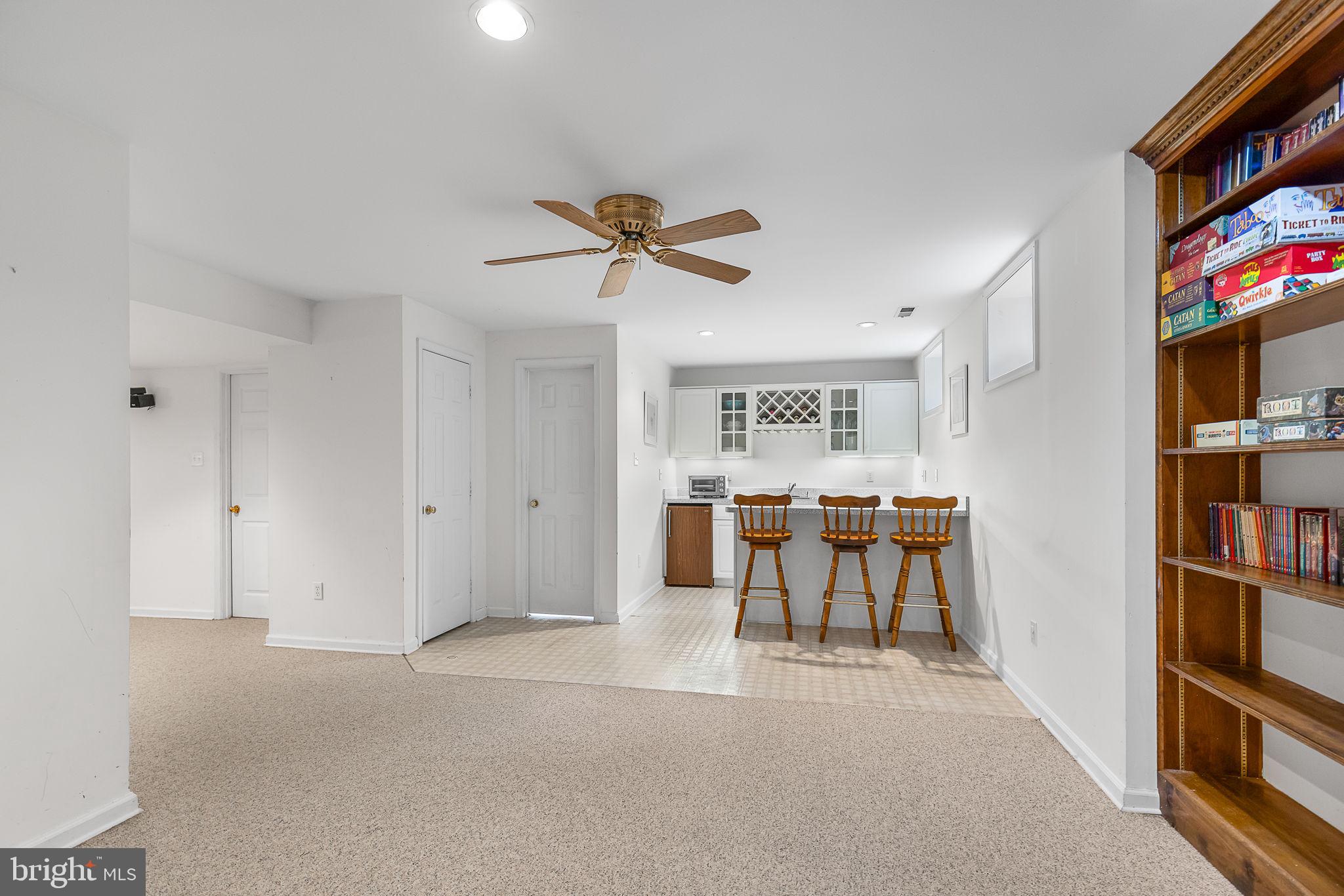 104 Dent Road Stafford, VA 22554 - Photo 47 of 118 a living room with furniture a bookshelf and a flat screen tv