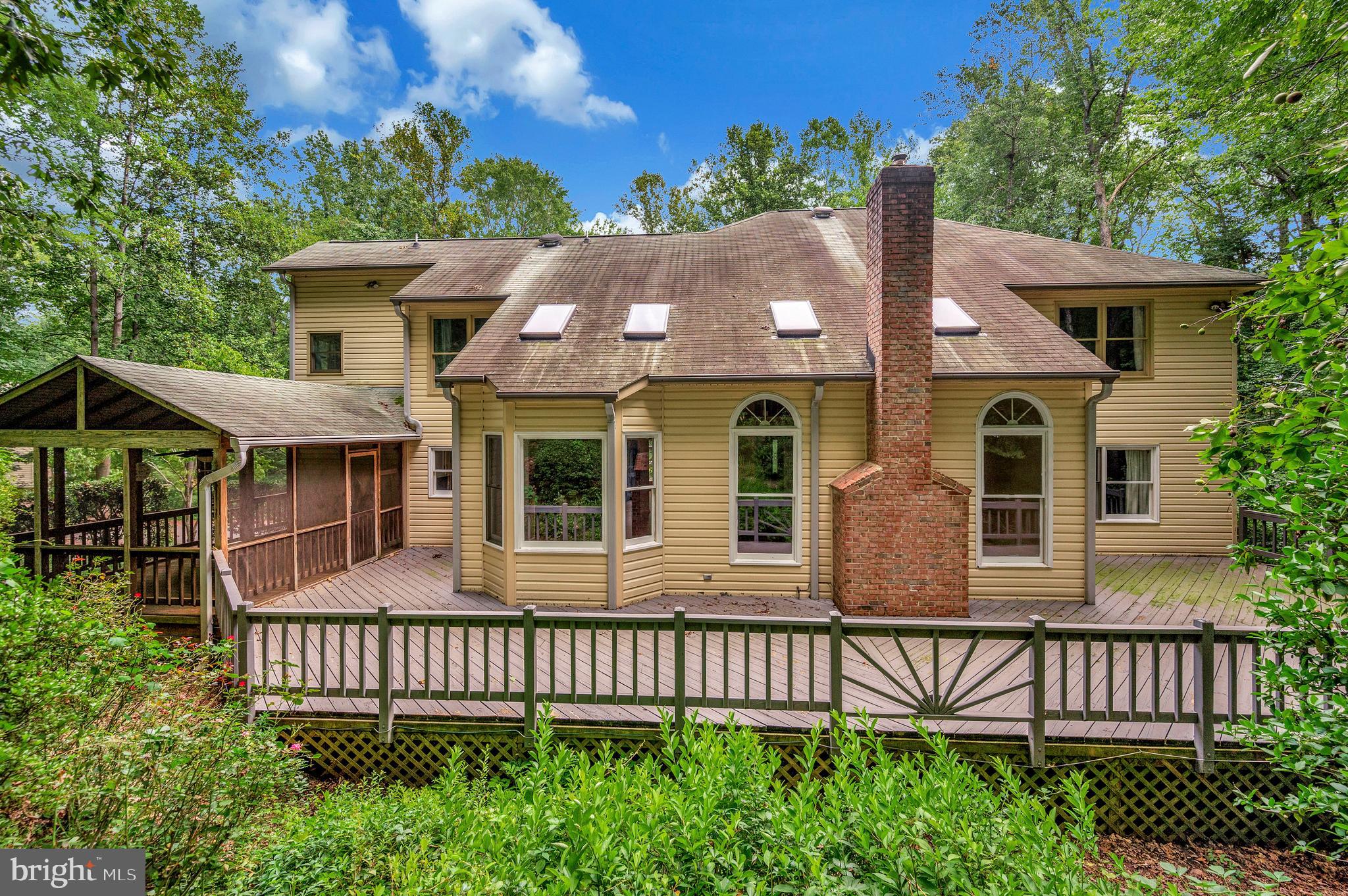 104 Dent Road Stafford, VA 22554 - Photo 85 of 118 a front view of a house with a garden
