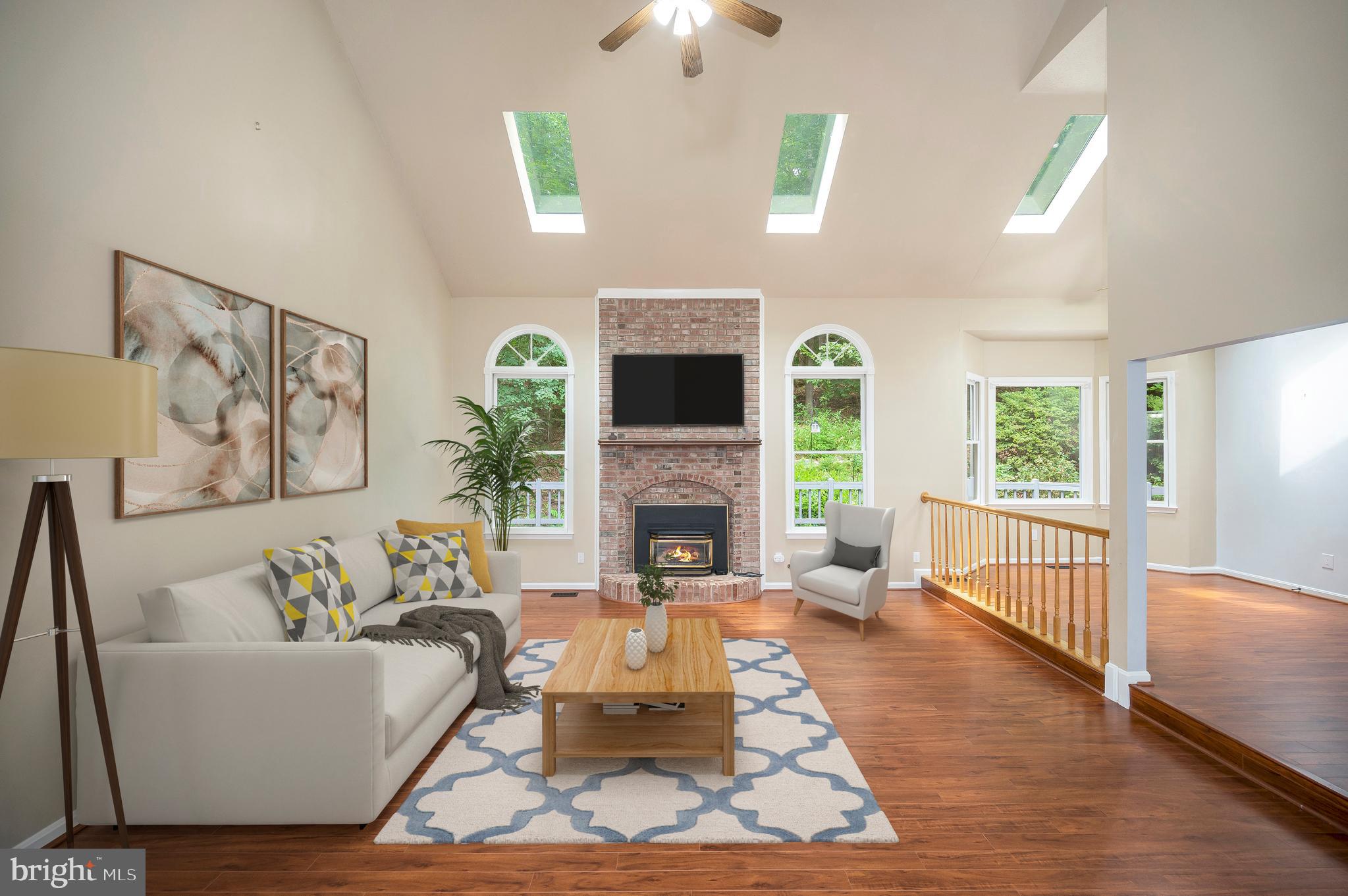 104 Dent Road Stafford, VA 22554 - Photo 9 of 118 a living room with furniture a fireplace and a flat screen tv