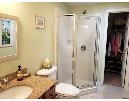 7 Blackmore Pond Road Wareham, MA 02576 - Photo 13 of 21 a bathroom with a granite countertop sink and a mirror