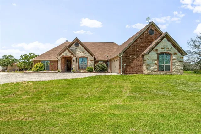 a front view of house with garden
