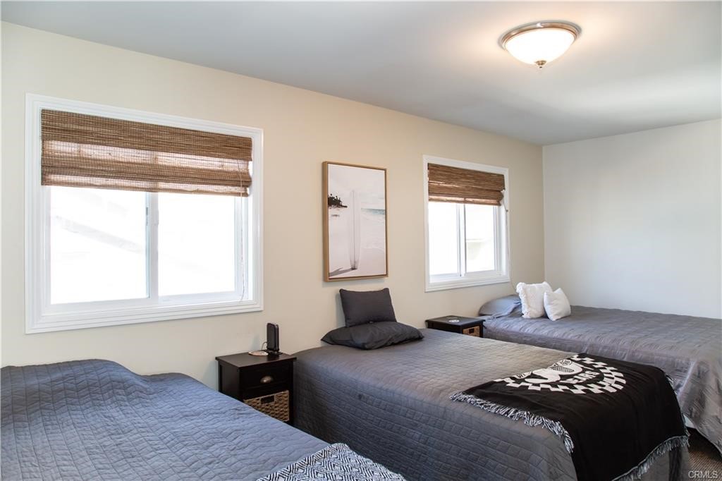 35 Surfside Avenue Surfside, CA 90743 - Photo 14 of 34 a bedroom with a bed and a window