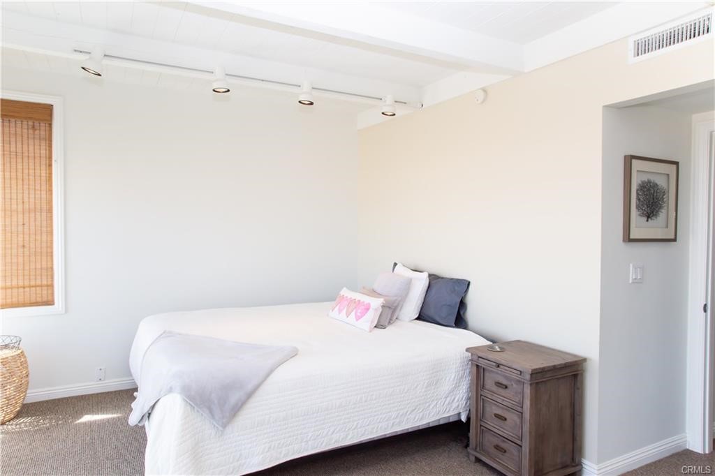 35 Surfside Avenue Surfside, CA 90743 - Photo 22 of 34 a bedroom with a bed and a window