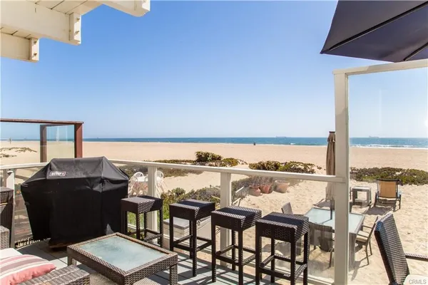 a view of a chairs and table in a terrace