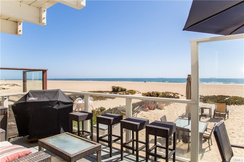 35 Surfside Avenue Surfside, CA 90743 - Photo 28 of 34 a view of a chairs and table in a terrace