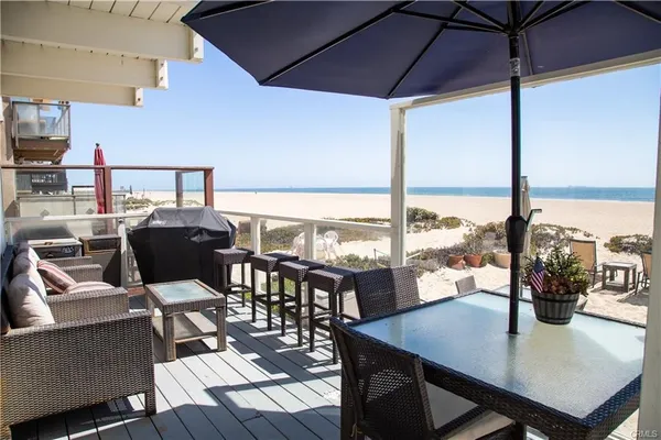 a view of a dining room with furniture and window