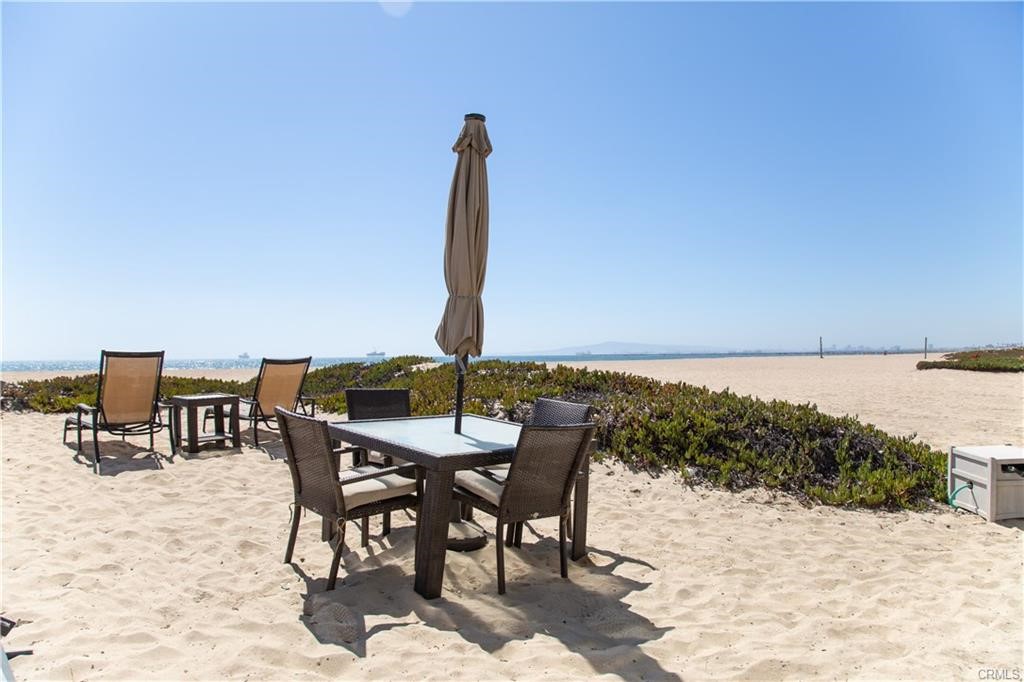 35 Surfside Avenue Surfside, CA 90743 - Photo 31 of 34 a view of a ocean with a table and chairs