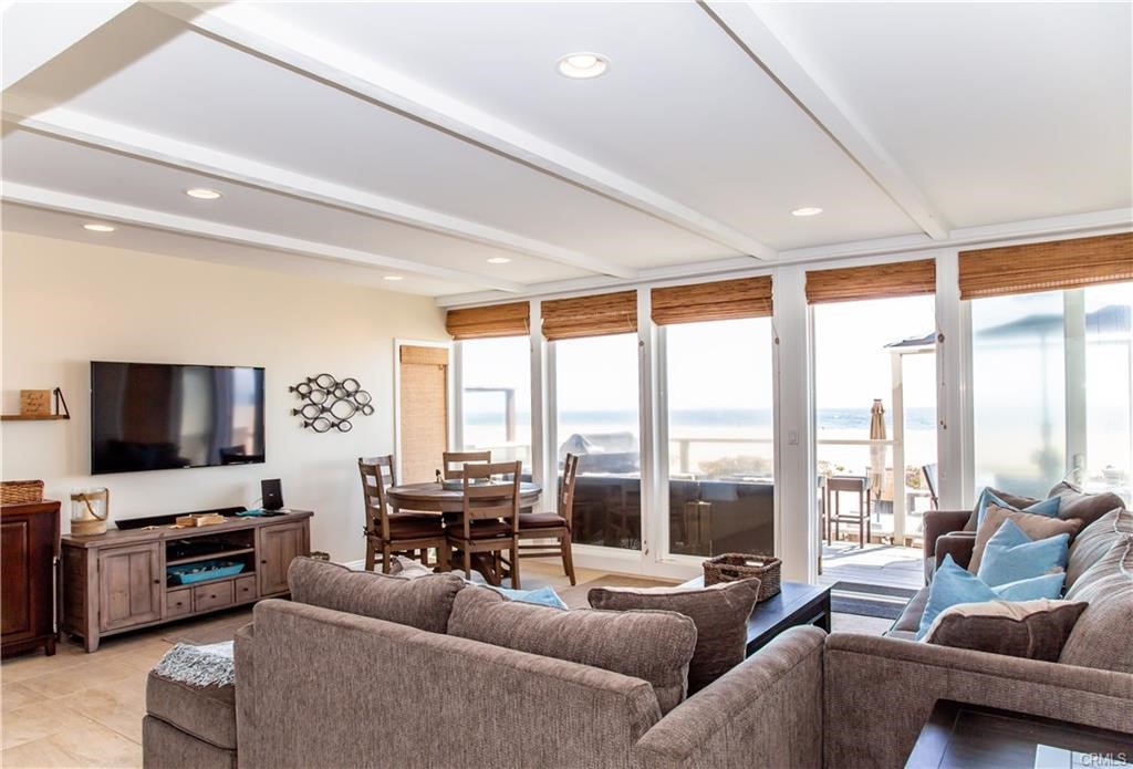 35 Surfside Avenue Surfside, CA 90743 - Photo 4 of 34 a living room with furniture and a flat screen tv