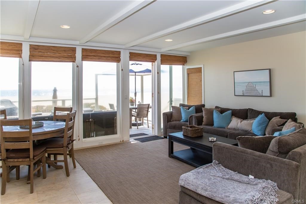 35 Surfside Avenue Surfside, CA 90743 - Photo 5 of 34 a living room with furniture and a floor to ceiling window