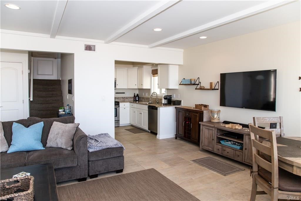 35 Surfside Avenue Surfside, CA 90743 - Photo 7 of 34 a living room with furniture and a flat screen tv