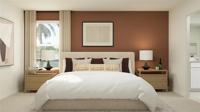 a bedroom with a bed and a night stand