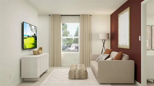 a living room with furniture and a window