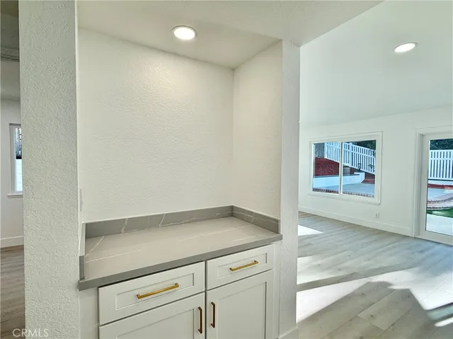 a workspace with furniture and a bookshelf