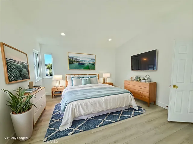 a spacious bathroom with a bathtub sink and mirror