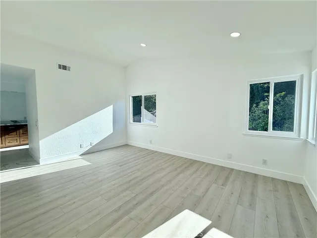 a bedroom with a bed a desk and chair