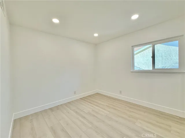 a view of a room with furniture and window
