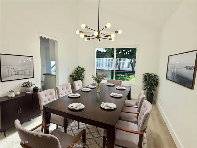 a view of a room with a window and a ceiling fan