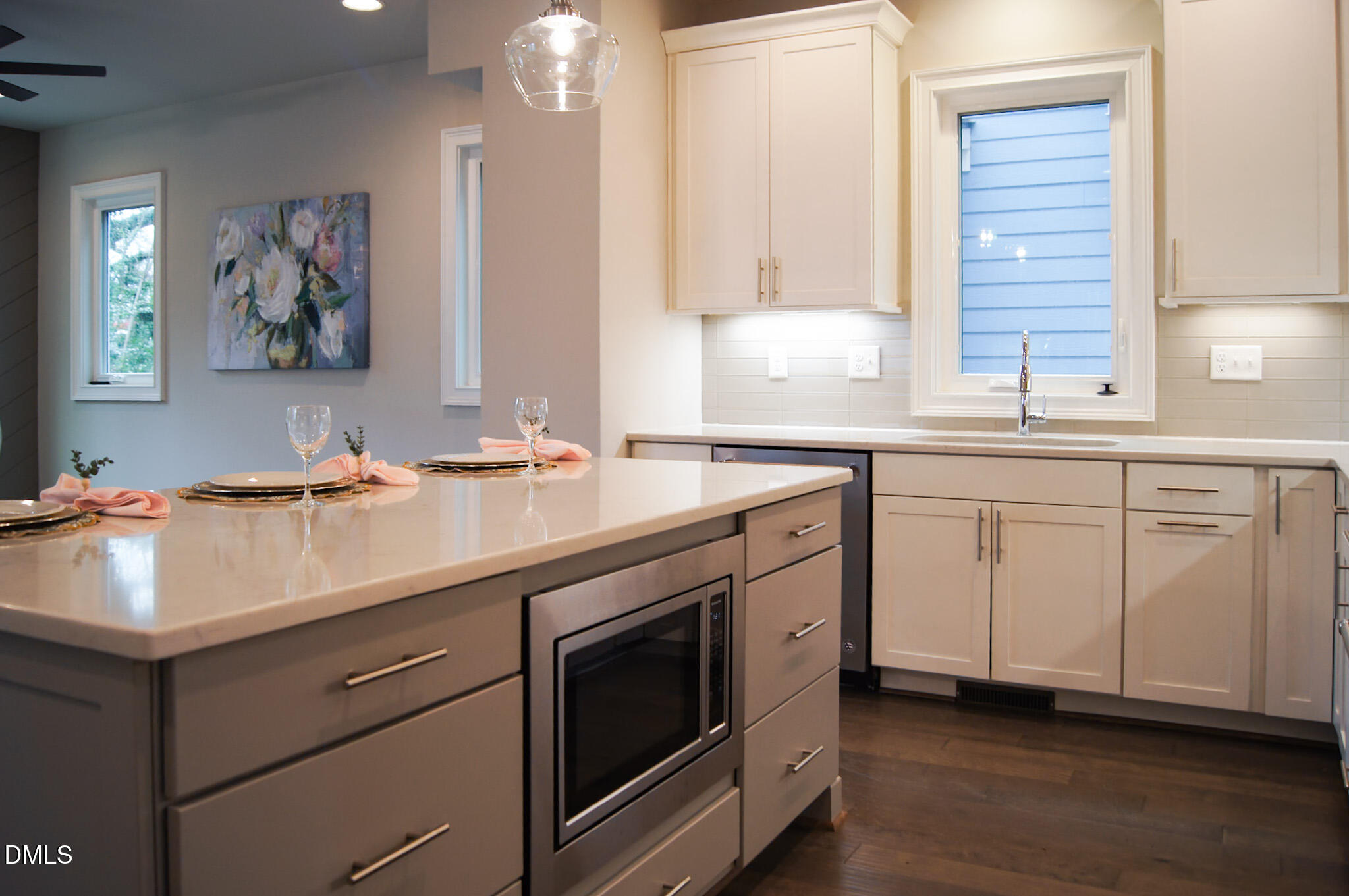 1208 Boyer Street Raleigh, NC 27610 - Photo 11 of 58 a kitchen with white cabinets and sink