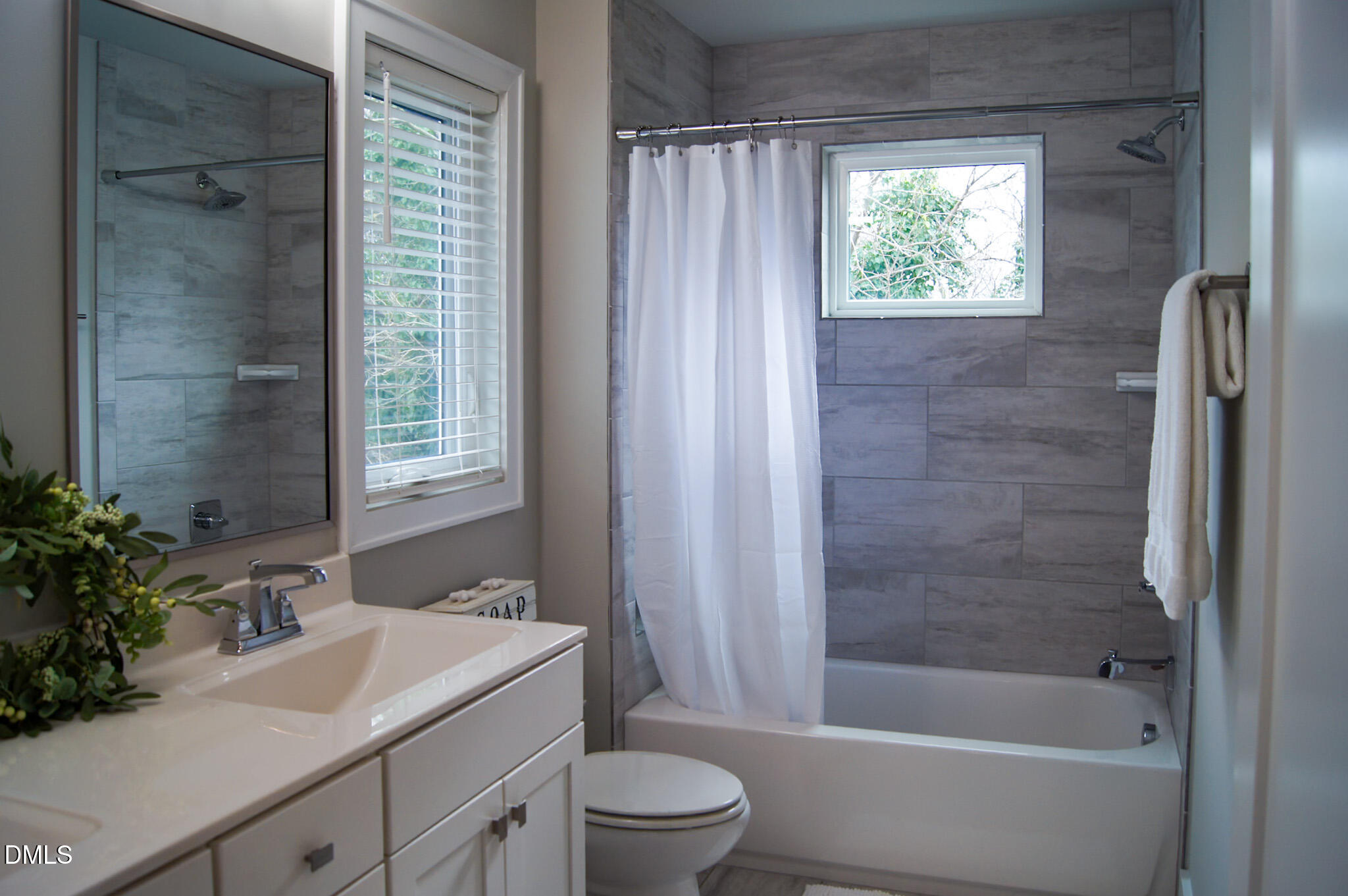 1208 Boyer Street Raleigh, NC 27610 - Photo 36 of 58 a bathroom with a sink toilet and shower