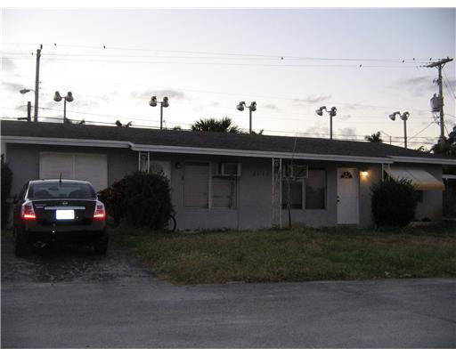 a view of a car parked in the yard