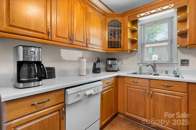 a kitchen with stainless steel appliances granite countertop a sink and cabinets