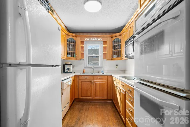 a kitchen with stainless steel appliances granite countertop a sink and cabinets