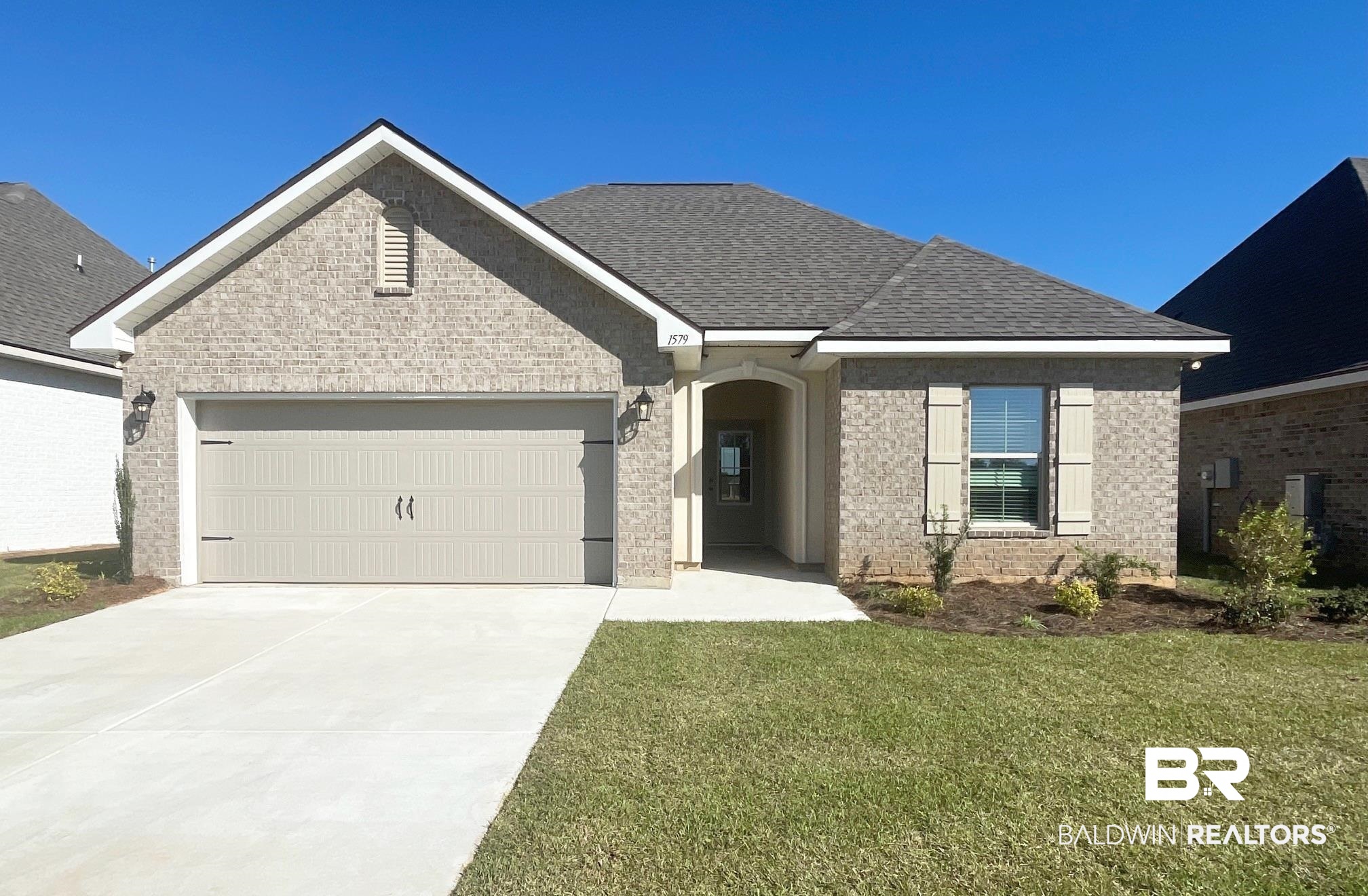 1579 Fenton Circle Foley, AL 36535 - Photo 1 of 14 View of front of property with a garage and a front yard