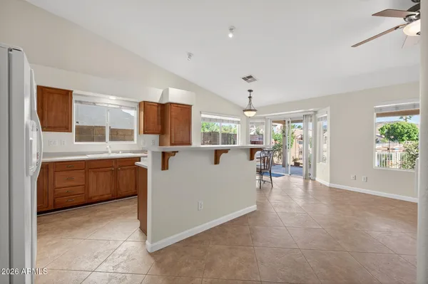 a dining room with furniture a rug and a large window