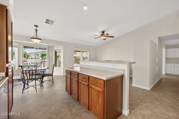 a living room with furniture a table and chairs