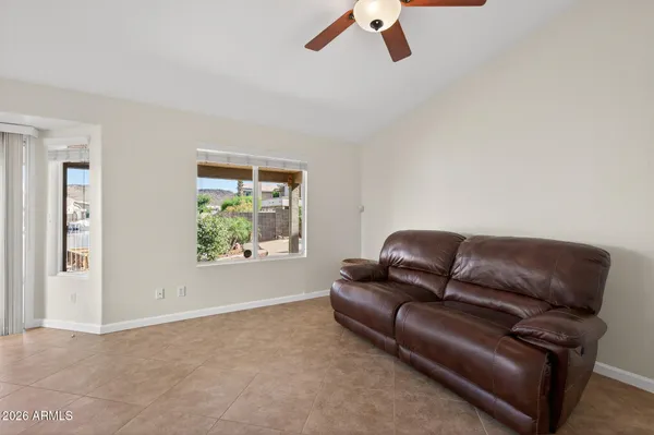 a bathroom with a tub a sink and mirror