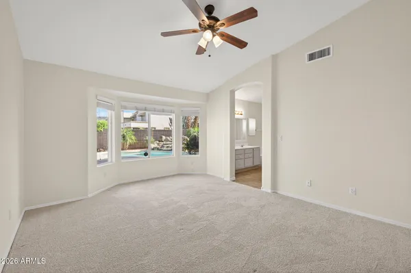 a view of an empty room with glass door
