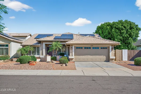 a backyard of a house with yard and outdoor seating