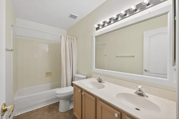 a view of a house with swimming pool and sitting area