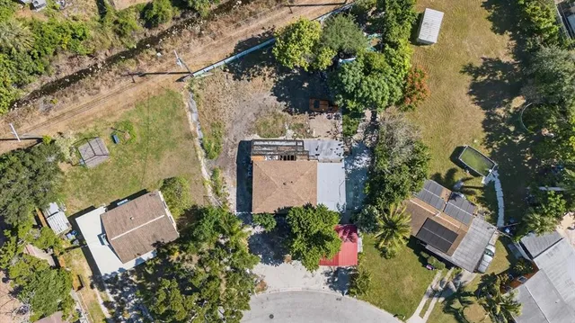 an aerial view of a house with outdoor space and street view