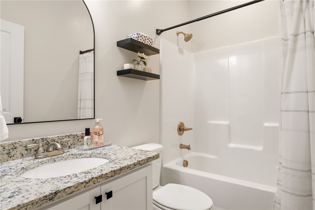 47 A Main Street Pelzer, SC 29669 - Photo 21 of 27 This bathroom features a spacious vanity and sleek fixtures.